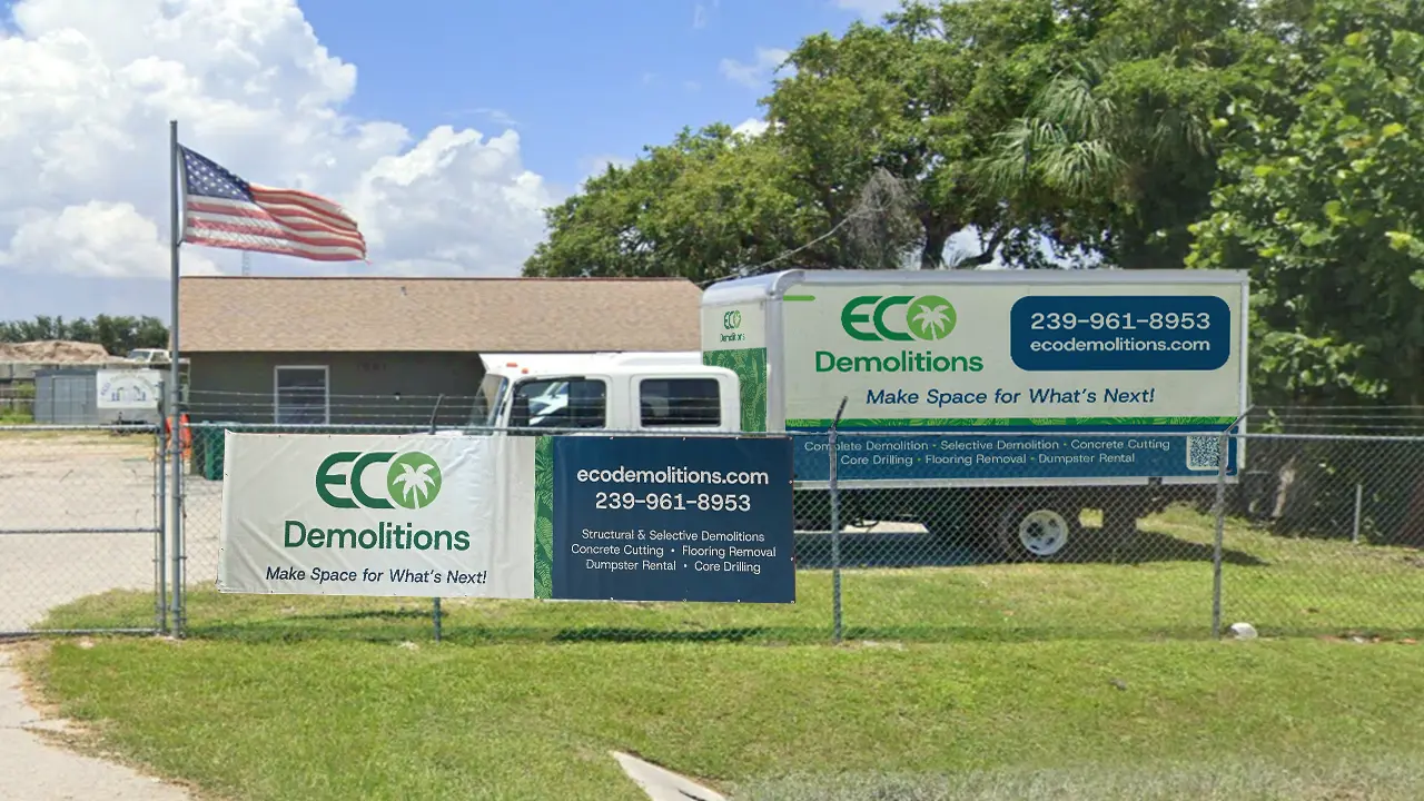 Eco Demolitions gate sign and box truck at their Naples location.