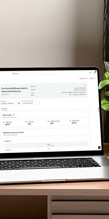 Results for an email campaign launched from Mail Chimp for a client, showing a 56.1% open rate, 7.1% click rate, and 97.7% delivery rate on a laptop.