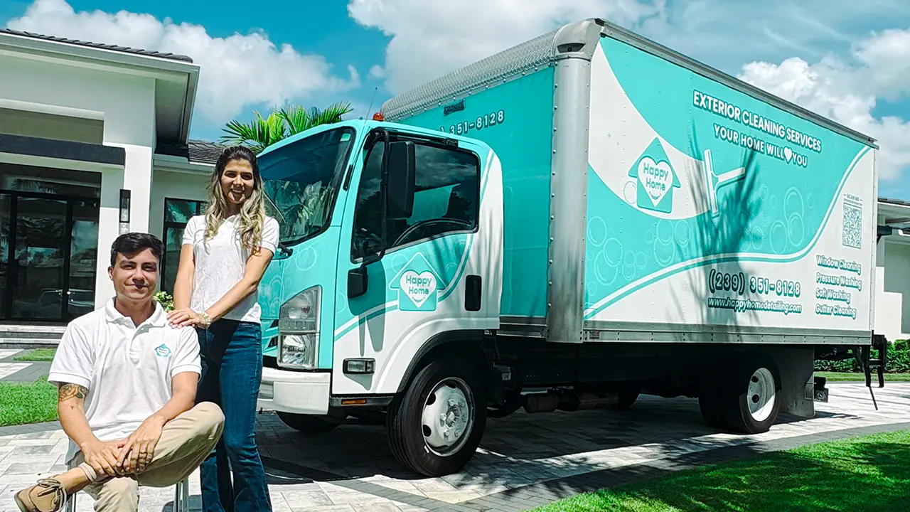 Owners Luis and Kristen in front of their custom wrapped box truck.